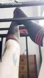 Caged Slave Girl in knee High Socks Rubs Feet Against Bars snapshot 3