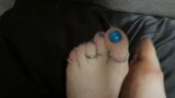 Mistress Lara plays with her perfect feet and toes in silver rings. Foot fetish snapshot 4