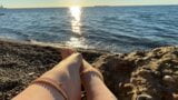 Mistress Lara plays with her feet and toes on the beach snapshot 5