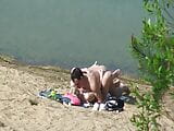 A couple of young nudists are spied on while having sex and snapshot 8