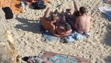 Group of guys having sex on the beach snapshot 4