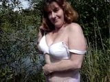 Milf stripping naked by the Riverside snapshot 5