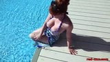 Mature redhead RedXXX fucking and masturbating poolside snapshot 1