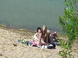 A couple of young nudists are spied on while having sex and snapshot 15