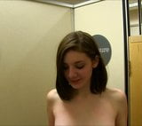 Brunette in changing room grabbing her boobs. snapshot 1