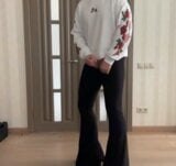 Sissy in flared boot cut black trousers and white hoodie with roses masturbating and dancing for your pleasure snapshot 7