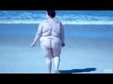 Fat Slut walking on beach snapshot 2