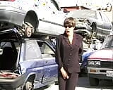 Short-haired German babe getting fucked by two hard cocks at the car waste snapshot 3