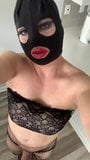 Masked Sissy in fishnets and heels posing snapshot 1
