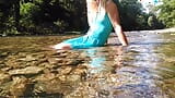 Sexy t-girl swimming in mountain river and wetting teal summer dress ... snapshot 5