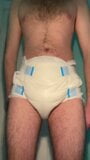 Diaper boy is peeing in a fresh diaper snapshot 1