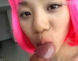 Asian girl with pink wig gives head snapshot 7