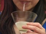 Two sexy Japanese women spit in a glass and... snapshot 12