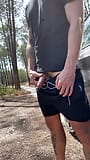 Short pee break in a public parking lot in the forest snapshot 4