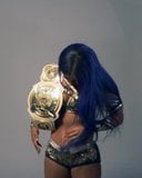 WWE - Sasha Banks and Bayley posing with the Tag Team titles snapshot 2