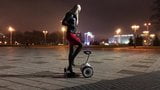 Hot girl driving gyroscooter in high heels and short skirt snapshot 4