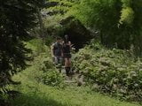 Slim brunette tranny and young dude suck each others' cock in the park snapshot 1