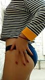 Daytime home striptease in a striped shirt. Close-up snapshot 3