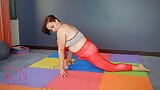 Regina Noir. A woman in yoga leotards practices yoga in the gym. Transparent red leotard yoga.  c1 snapshot 4