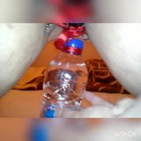 Slave lifts a water bottle with her pussy lips snapshot 1