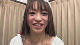 Funky Japanese babe chats to the camera in an interview snapshot 8