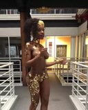 African Girl Wearing Gold Walks snapshot 4