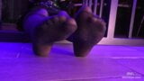 Mistress’s pretty feet in black pantyhose and colored toenails snapshot 3