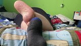 Chubby boy relaxes his sweaty socked feet snapshot 7