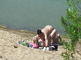 A couple of young nudists are spied on while having sex and snapshot 9