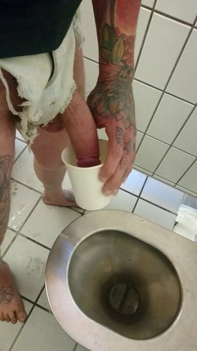 Barefoot on a public toilet