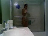 Girl in glass taking a shower snapshot 10