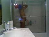 Girl in glass taking a shower snapshot 6