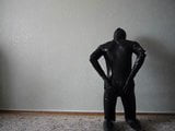 young man in latex catsuit caresses himself snapshot 6