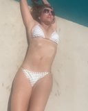 Elizabeth Hurley laying by the pool in a white bikini snapshot 4