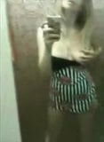 Amateur strips and masturbates in front of a mirror snapshot 2