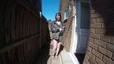 Skinny young wife flashing coat in yard snapshot 1