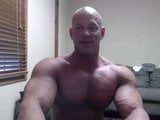 Bald bodybuilder flex, work out, and jerk off snapshot 1