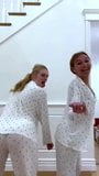 Elle Fanning and a blonde friend dancing in their pajamas snapshot 5