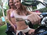 2 girls revving motorcycle in boots snapshot 5