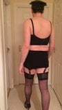 Crossdressing posing in gay cop lingerie stockings and heels snapshot 1