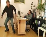 An amazing looking German blonde taking two hard cocks in the office snapshot 3