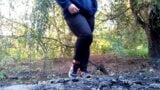 MILF in jeans and sanitary pad on panties pissing on the river snapshot 2