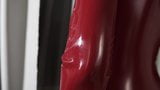 blonde in red catsuit snapshot 2