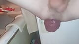 A young guy squatting, pushing and squeezing out a sweetly gigantic anal prolapse in his bathtub while no one is watch snapshot 9